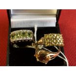 Hallmarked Jewellery: Three 9ct. gold rings, one set with citrine, one set with yellow sapphires and