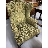 19th cent. Wingback armchair on club supports.