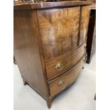 Early 20th cent. Bow front mahogany cupboard with two drawers. 26in.