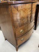 Early 20th cent. Bow front mahogany cupboard with two drawers. 26in.