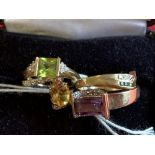 Hallmarked Jewellery: Four 9ct. gold rings, one set with amethyst, one with peridot and diamonds,