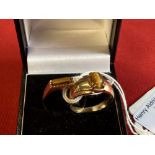 Hallmarked Jewellery: 9ct. Gold ring set with a rectangular cut tigers eye, hallmarked London,