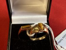 Hallmarked Jewellery: 9ct. Gold ring set with a rectangular cut tigers eye, hallmarked London,