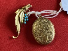 Jewellery: Yellow metal oval hinged engraved locket, tests as 18ct. gold. Plus an 18ct. leaf