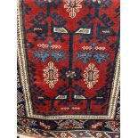 Carpets & Rugs: 19th cent. Shirvan carpet with a red central ground with geometric designs in