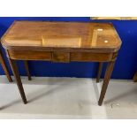 19th cent. Regency mahogany folding top tea table on a turned pedestal platform base and reeded