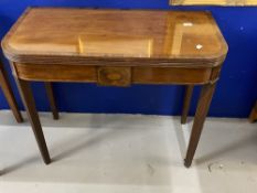 19th cent. Regency mahogany folding top tea table on a turned pedestal platform base and reeded