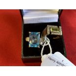 Hallmarked Jewellery: Two 9ct. gold rings, one set with a blue topaz, the other with a peridot and