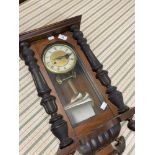 Clocks: 20th cent. German striking wall clock in mahogany case, a Napoleon hat mantel clock in