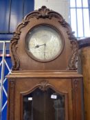 Clocks: Late 19th/early 20th cent. German oak three chain longcase clock, 11in. silvered dial with