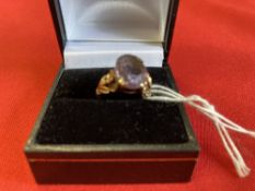 Jewellery: Yellow metal ring set with an oval amethyst, test as 9ct. Weight 3·2g.