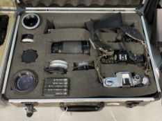 Photographic Equipment: Analogue aluminium case containing a Canon AT-1 camera body, a Canon A-1