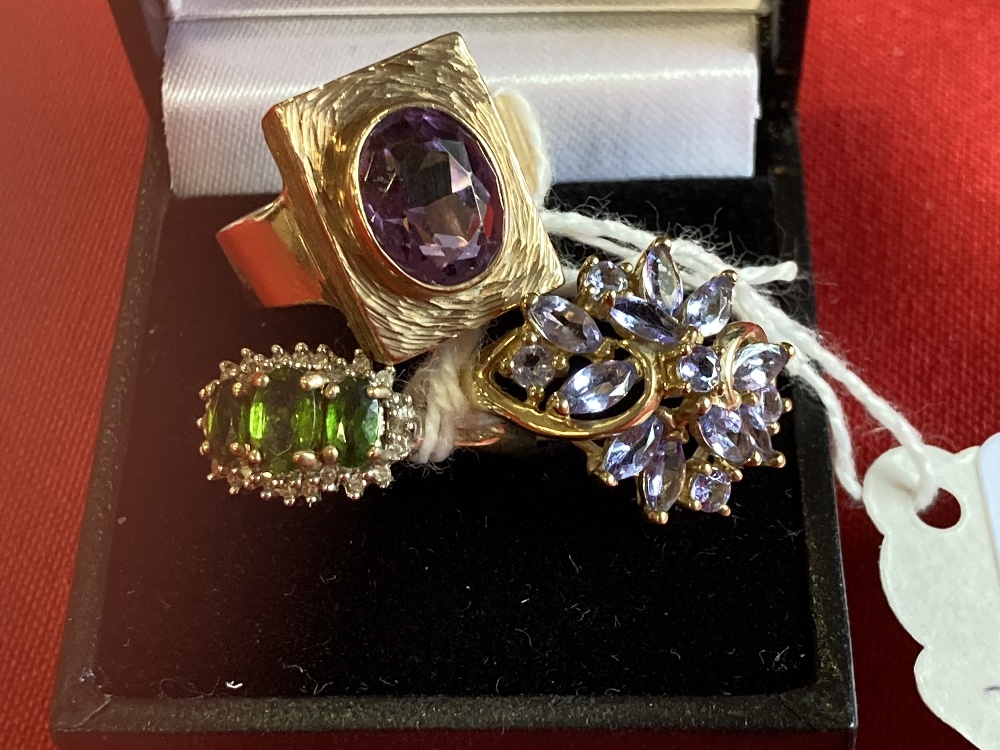 Hallmarked Jewellery: Three 9ct. gold rings, one set with a single amethyst, one with sapphires, and