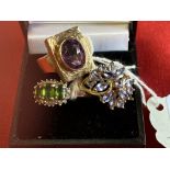 Hallmarked Jewellery: Three 9ct. gold rings, one set with a single amethyst, one with sapphires, and