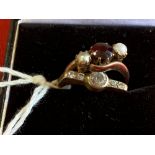 Hallmarked Jewellery: Two 9ct. gold rings, one set with a garnet and cultured pearls, and one set