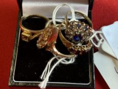 Hallmarked Jewellery: Three 9ct. gold rings, one set with five graduated oval cut garnets,