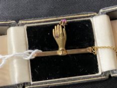 Gold Jewellery: 15ct. and 625 Chester hallmarked hand of Fatima bar brooch set with red stone.