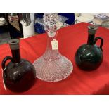 Early 20th cent. Coloured glass wine decanter, bulbous form with flattened side, tall neck and