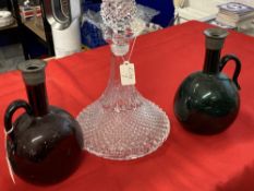 Early 20th cent. Coloured glass wine decanter, bulbous form with flattened side, tall neck and