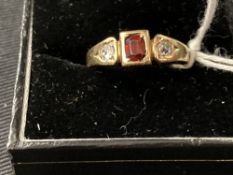 Gold Jewellery: Stamped 18ct. ring set with two old cut diamonds 0.20ct. total with a central