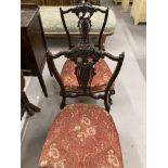 Late 19th/early 20th cent. pair of ebonised mahogany nursing chairs with pierced slat backs.