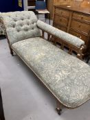 Edwardian oak button back chaise longue.