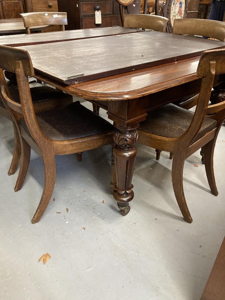 19th cent. Mahogany extending dining table with two leaves.