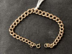 Jewellery: Yellow metal curb link bracelet, tests as 9ct gold. Weight 17·9g.