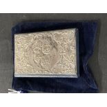 Hallmarked Silver: Notelet book with repousse front depicting Putti, leather body & velvet case,