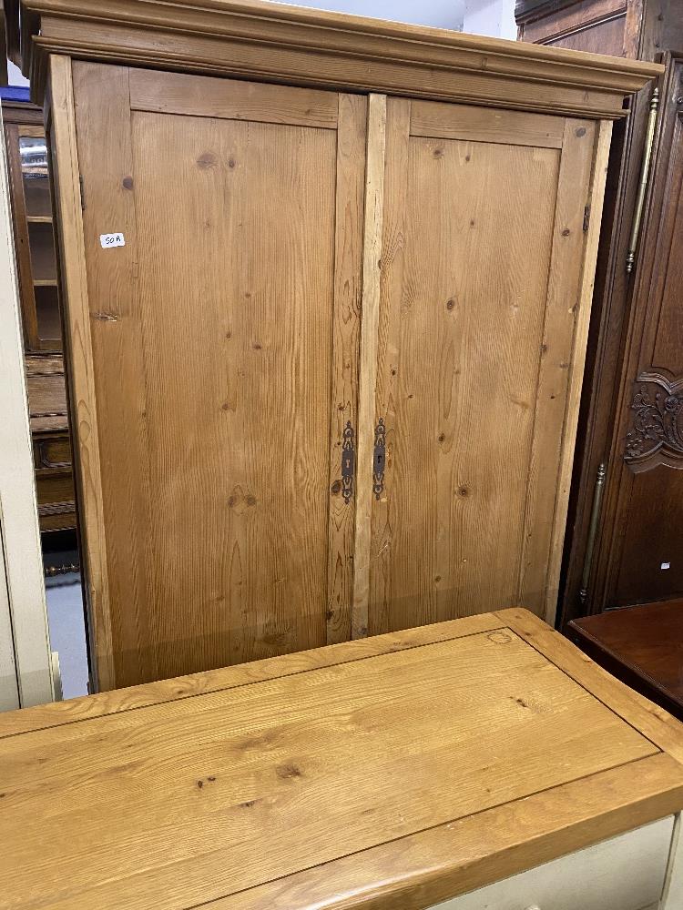 20th cent. Stripped pine wardrobe with drawer.