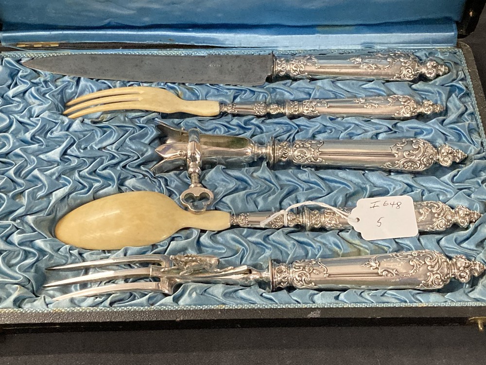 White metal five piece carving set in fitted case, retailed by C. Detouche, Paris. Tests as