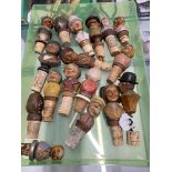 Breweriana: 20th cent. Novelty cork bottle stoppers with carved grotesque head treen finials (17)