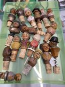 Breweriana: 20th cent. Novelty cork bottle stoppers with carved grotesque head treen finials (17)