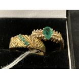 Jewellery: Two yellow metal rings, one set with an oval cut emerald with six brilliant cut