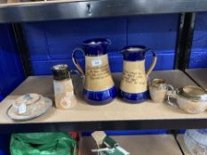 Royal Doulton: Waisted jugs, cobalt blue rim and base, with motto 'The Wisest of People' etc. 10ins.