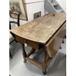 18th/19th cent. Oak drop leaf, gate leg dining table with later additions, on gun barrel supports