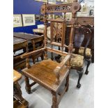 19th cent. Oak Gothic style elbow chair, turned and fretwork back and supports.