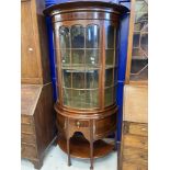 Early 20th cent. Mahogany bow fronted, Regency revival glazed display cabinet, over one drawer & two