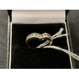 Diamond wishbone ring set with nine brilliant cut stones, estimated weight 0·35ct. stamped and