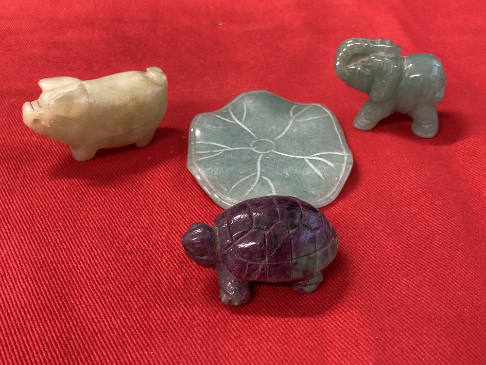 Oriental Objects of Virtue: Carved jade pale green lily pad and elephant, off white pig pendant,