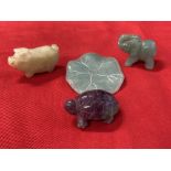 Oriental Objects of Virtue: Carved jade pale green lily pad and elephant, off white pig pendant,