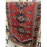 Carpets & Rugs: 19th cent. Kazak style runner with red ground and nine large guls with geometric