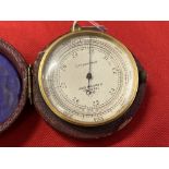 Scientific Instruments: Compensated pocket barometer, gilt cased, dial 2ins. diameter, signed