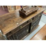 18th/19th cent. French walnut buffet with heavily carved panels depicting folk scenes. 61ins.