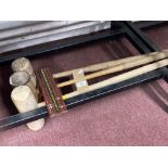 Three polo mallets and wooden snooker scoreboard.