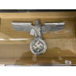 Militaria: Third Reich polished aluminium large eagle and swastika on an oak framed display board.