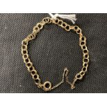 Jewellery: Yellow metal double circular link bracelet tests as 9ct gold. Weight 4·9g.
