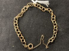 Jewellery: Yellow metal double circular link bracelet tests as 9ct gold. Weight 4·9g.