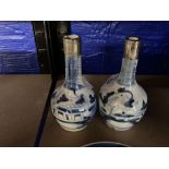 Chinese blue and white long necked mallet shaped vases with white metal collars, a pair. 6ins.