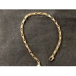 Jewellery: Yellow metal bracelet, tests as 9ct. Stamped 375. Weight 6·1g.